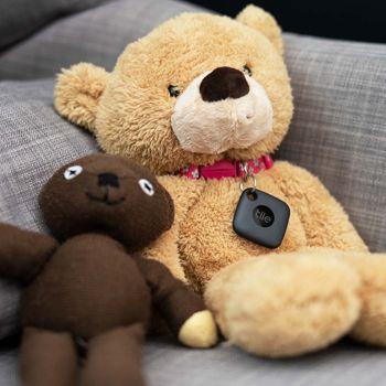 Black Tile mate tracker on the collar of a teddy bear