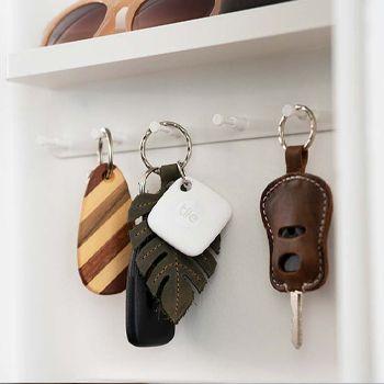 White Tile Tracker on a keyring hung up in the entranceway