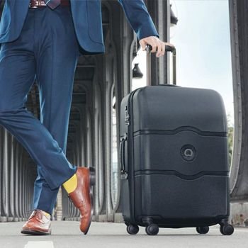 Business Man with his Black Delsey Suitcase
