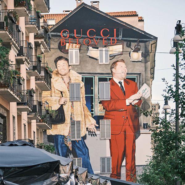 Image of harry styles and james corden on a Gucci Beloved building in Milan