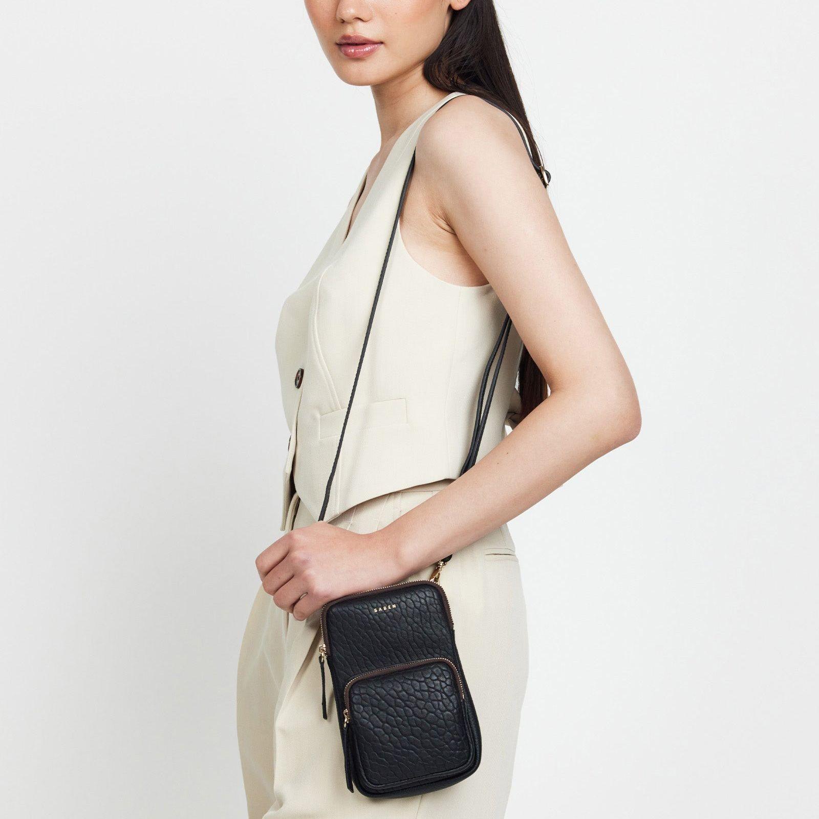 Model shot of a woman wearing Saben Nikko Phone Sling