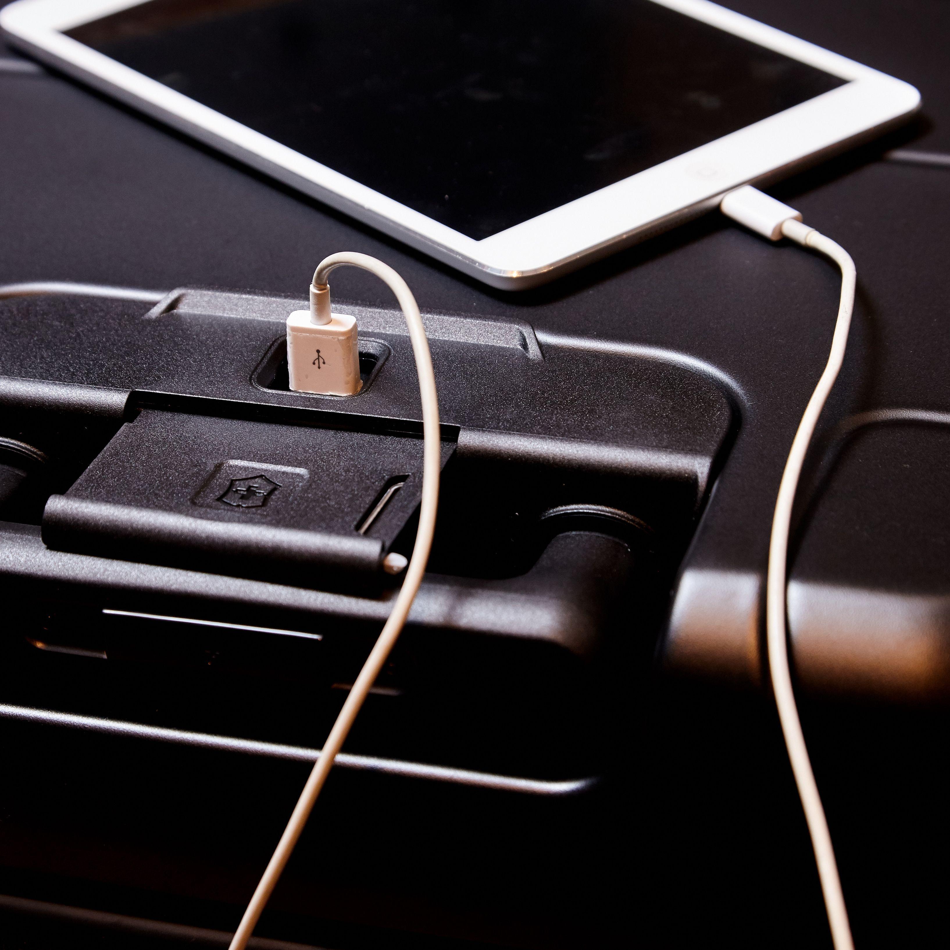 Phone charging on carry-on luggage