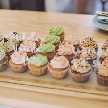 Rows of cupcakes at a cafe