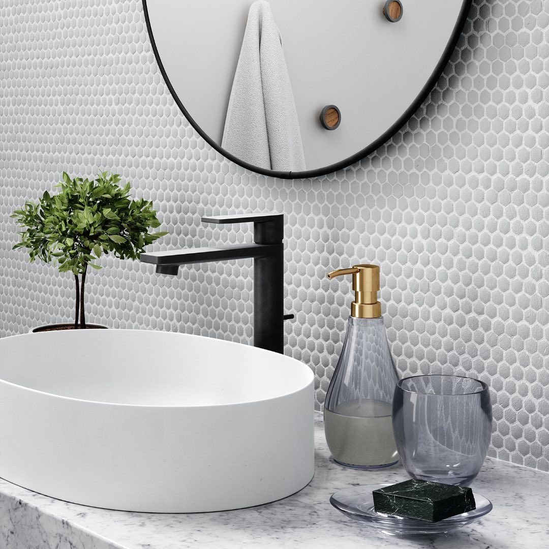 bathroom sink with Umbra mirror