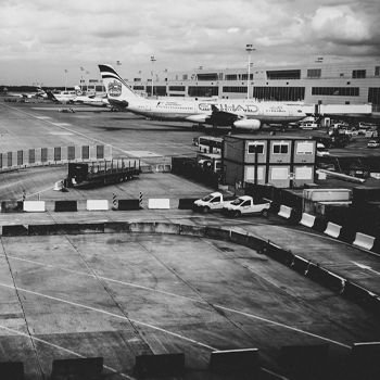 Airplane parked on the landing strip at the airport