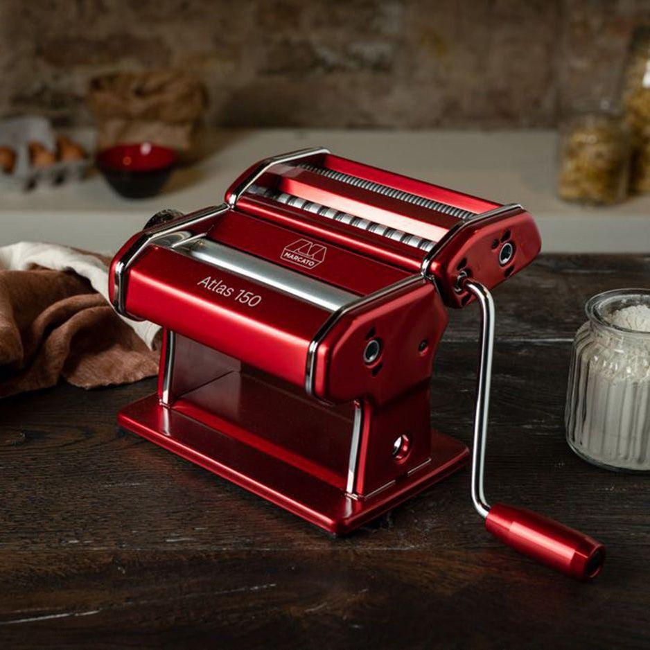 Red Pasta Machine on a dark wood bench