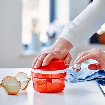 Tupperware supersonic chopper in use, chopping an onion