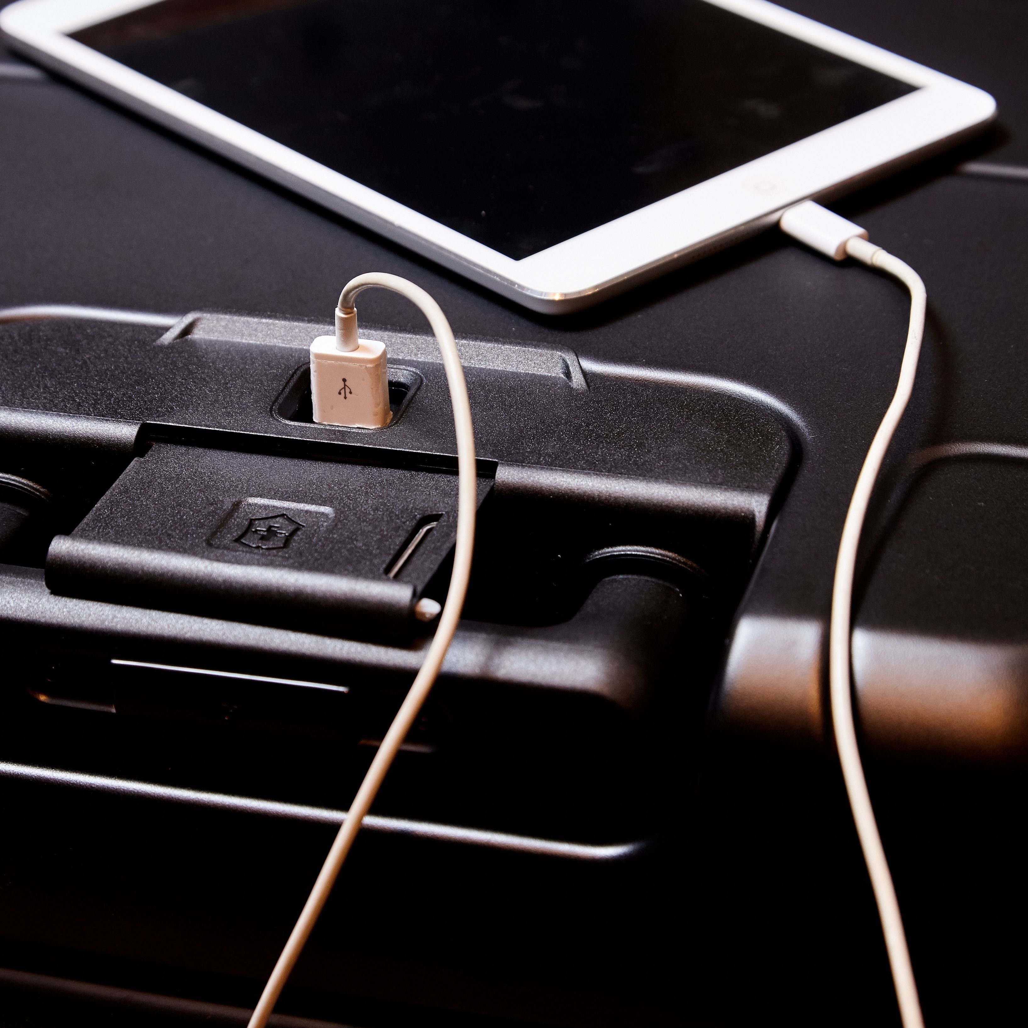 Phone charging on carry-on luggage
