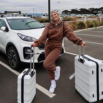 Kelsey Odell in a brown matching tracksuit featuring her white luna-air cases