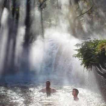People soaking in a natural hot spring