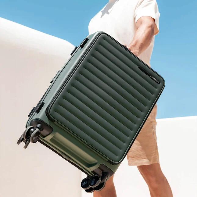 Person carrying Samsonite carry-on Restackd 