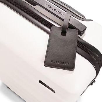 Explorer Luggage Tag attached to the top grab handle of the Luna Air (White)Suitcase